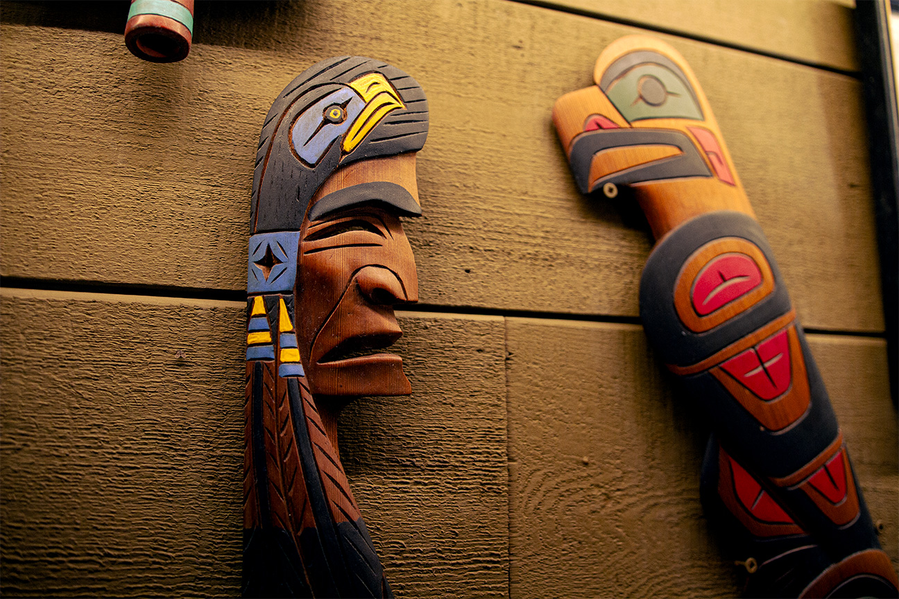 first nations carvings hanging on wall